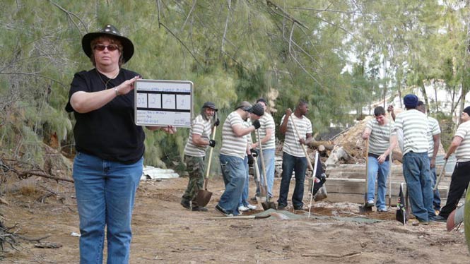 filming a scene of prisoners digging