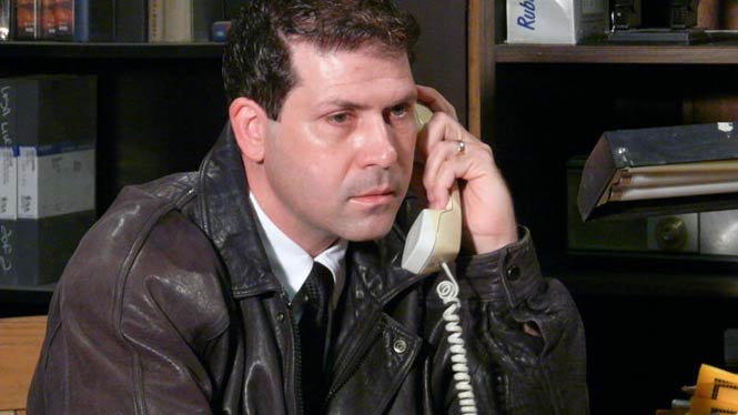 Man with intense expression on a phone